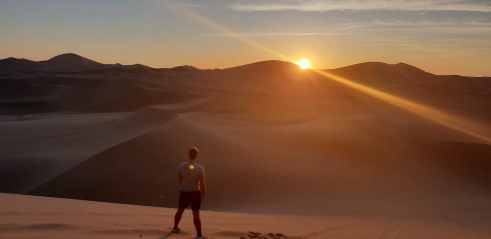 Sandboarden Huacachina Peru zonsondergang